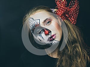 Halloween, the face of a girl is a doll, the floor of a face is dead. A woman with a horrible make-up.