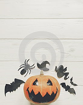 Halloween flat lay. jack lantern pumpkin with witch ghost bats a