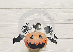 Halloween flat lay. jack lantern pumpkin with witch ghost bats a