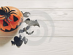 Halloween flat lay. jack lantern pumpkin with witch ghost bats a