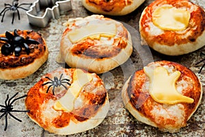 Halloween food and snack ideas - mini pizzas with tomato sauce a