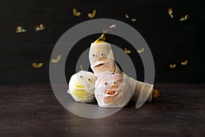 Halloween Fruit Mummy. Funny Scared orange, apple and banana wit