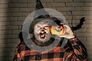 Halloween hipster with frown face in witch hat