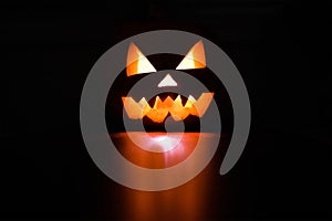 Halloween holiday celebration symbol, pumpkin glowing reflection