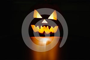 Halloween holiday celebration symbol, pumpkin glowing reflection