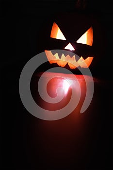 Halloween holiday celebration symbol, pumpkin glowing reflection