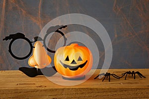 Halloween holiday concept. Cute pumpkin on wooden table