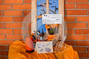 Halloween home decorations with spiders and pumpkin bucket for trick or treat. Greeting Card. Halloween pumpkin brick