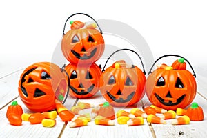 Halloween Jack o Lantern candy holders on white wood