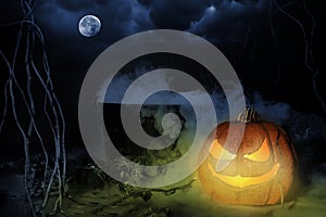 Halloween Jack-O-Lantern on Ground with Steaming Cauldron and Moon