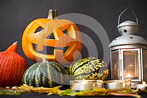 Halloween Jack o Lantern, among the pumpkins, lamps and candles