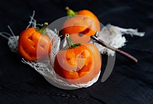 Halloween, Jack`s heads made of yellow bell pepper on a black background