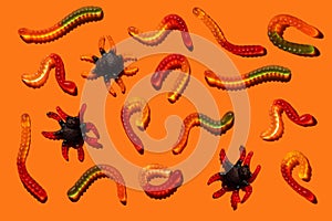 Halloween jelly beans worms spider orange background