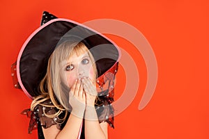 Halloween kid girl costume on orange