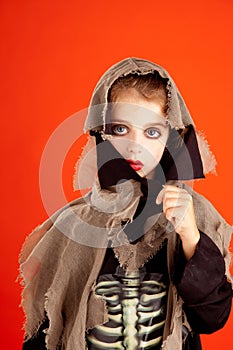 Halloween kid girl costume on orange