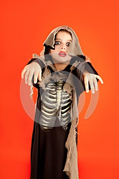 Halloween kid girl costume on orange