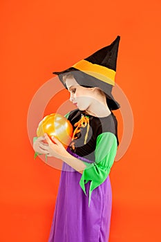Halloween kid girl costume on orange