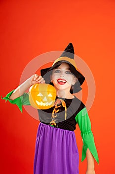 Halloween kid girl costume on orange