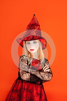 Halloween kid girl costume on orange