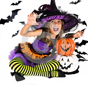 Halloween kids, Happy scary girl dressed up in halloween costumes of witch, sorcerer and vampire Dracula for pumpkin patch