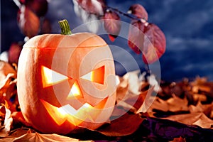 Halloween lantern pumpkin in dark sky clouds