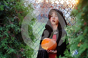 Halloween. Little boy portrays the evil wizard.