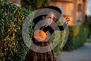 Halloween. Little girl portrays the evil enchantress.