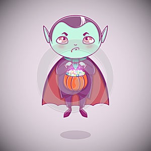Halloween little vampire Dracula. Boy kid with angry face in halloween costume with pumpkin in his hands.