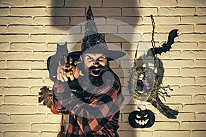 Halloween man with pumpkin in dark shadow