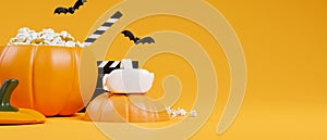 Halloween movie party concept, virtual reality headset, pumpkin popcorn bucket, orange background photo