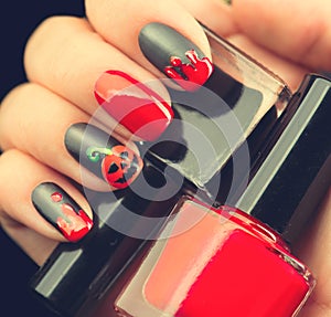 Halloween nail art design. Black matte nailpolish photo