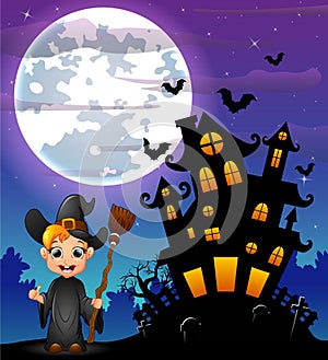 Halloween night background with little boy witch holding broomstick and scary castle in graveyard