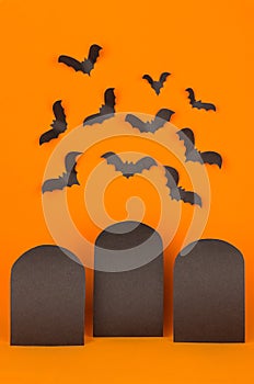 Halloween orange background with blank black sale labels and bats flock, mock up.