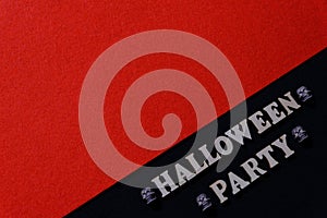 Halloween party concept. The inscription is made of wooden letters on a black background with a free space of red color. Small sku