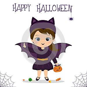 Halloween party. A cute little girl in a bat costume is holding a pumpkin with lollipops, a spider and cobwebs. Postcard