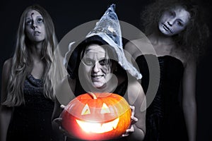 Halloween personages over dark background