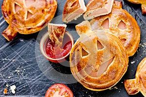 Halloween pizza idea - homemade calzone shaped pumpkin with ham