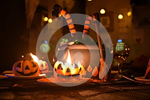 Halloween postcard, witch cauldron cake and pumpkin shape candle with open fire