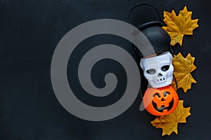 Halloween preparation. Decorative orange lantern pumpkins stay on a grunge background.