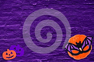 Halloween pumpkin bat flatlay purple background
