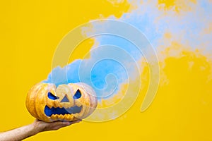 Halloween pumpkin With blue Smoke