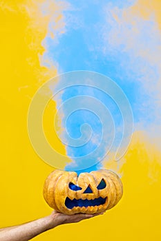 Halloween pumpkin With blue Smoke