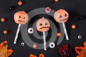 Halloween pumpkin cake pops on black