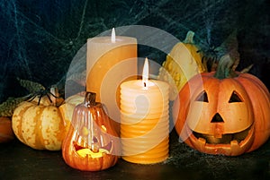 Halloween pumpkin decor with candle and spiders