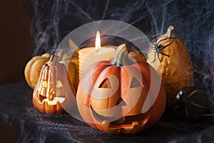 Halloween pumpkin decor with candle and spiders