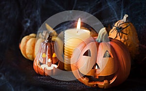 Halloween pumpkin decor with candle and spiders