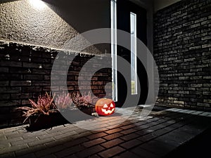 Halloween pumpkin at the fron door of house