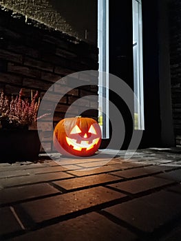 Halloween pumpkin at the fron door of house