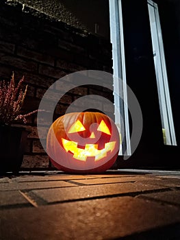 Halloween pumpkin at the fron door of house
