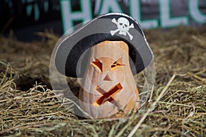 Halloween Pumpkin . Halloween pumpkin grinning in the most evil fashion . Spooky Halloween Jack o Lantern . Pumpkin on dry straw i